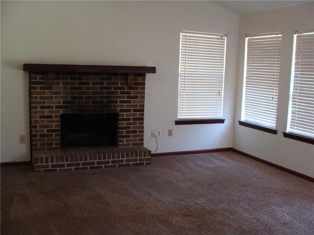 2331 Newgate Drive Decatur, GA 30035 - Photo 13 of 33 an empty room with fireplace and window
