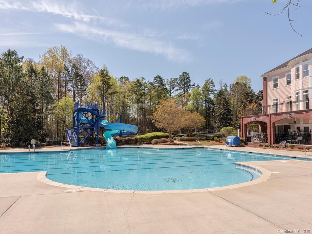 2001 Streamview Court Marvin, NC 28173 - Photo 32 of 35 a view of a house with a swimming pool and a yard