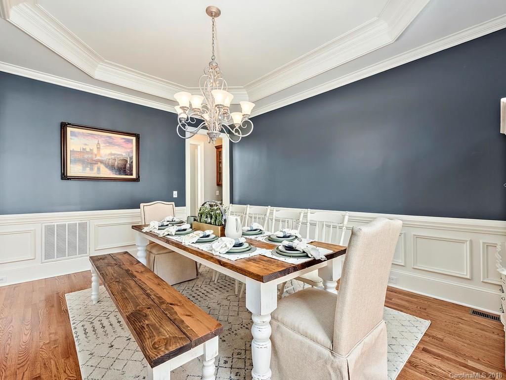 2001 Streamview Court Marvin, NC 28173 - Photo 6 of 35 a dining room with furniture a chandelier and wooden floor
