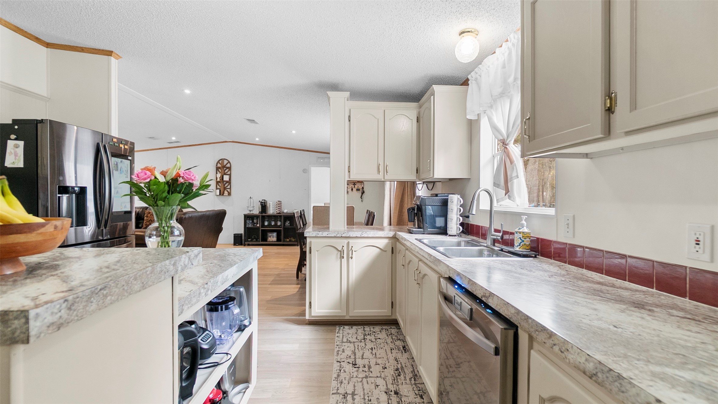 7735 North Walker Road Cleveland, TX 77328 - Photo 14 of 42 a kitchen with a sink stove and cabinets