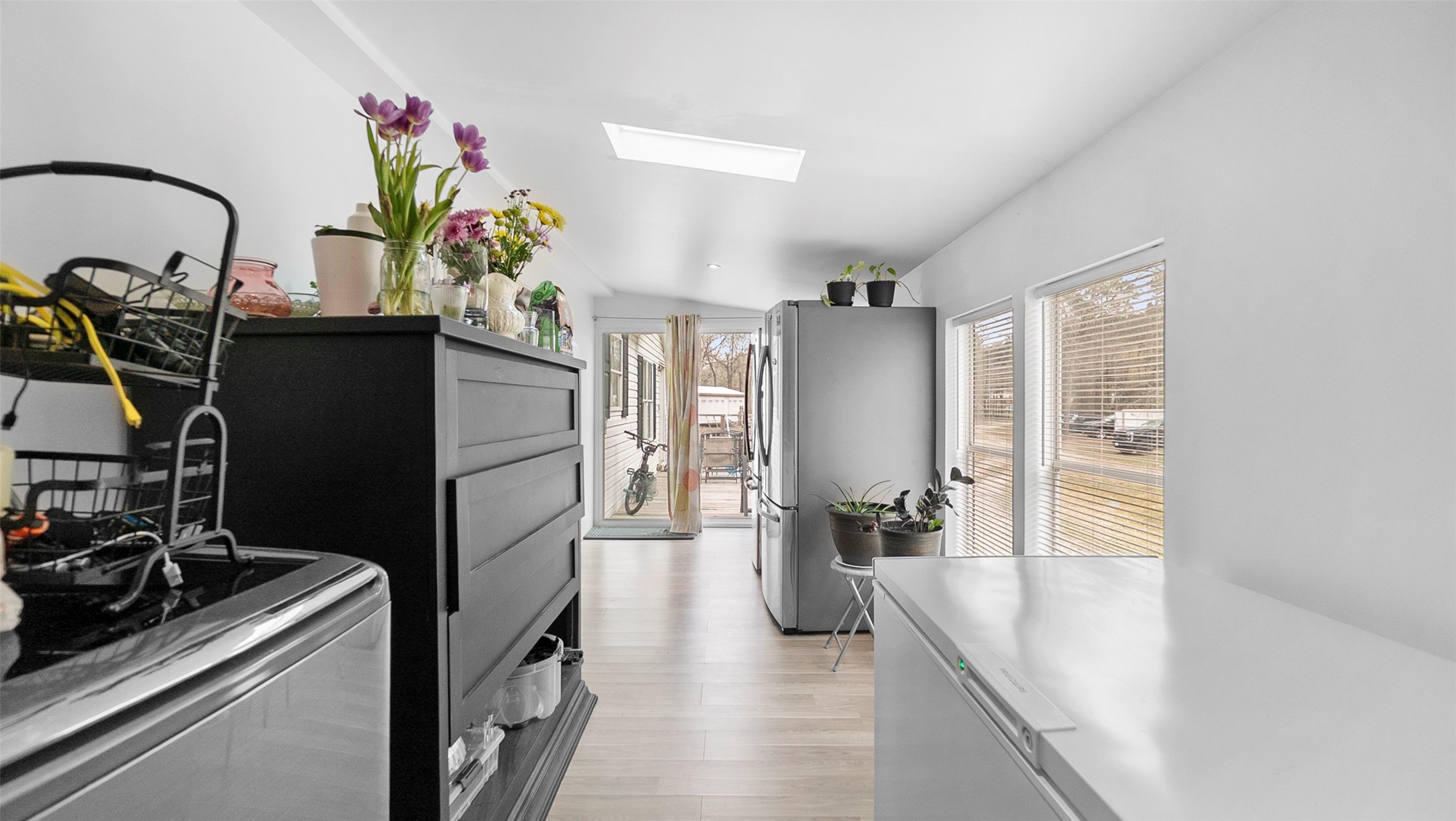 7735 North Walker Road Cleveland, TX 77328 - Photo 19 of 42 a kitchen with a refrigerator and a sink