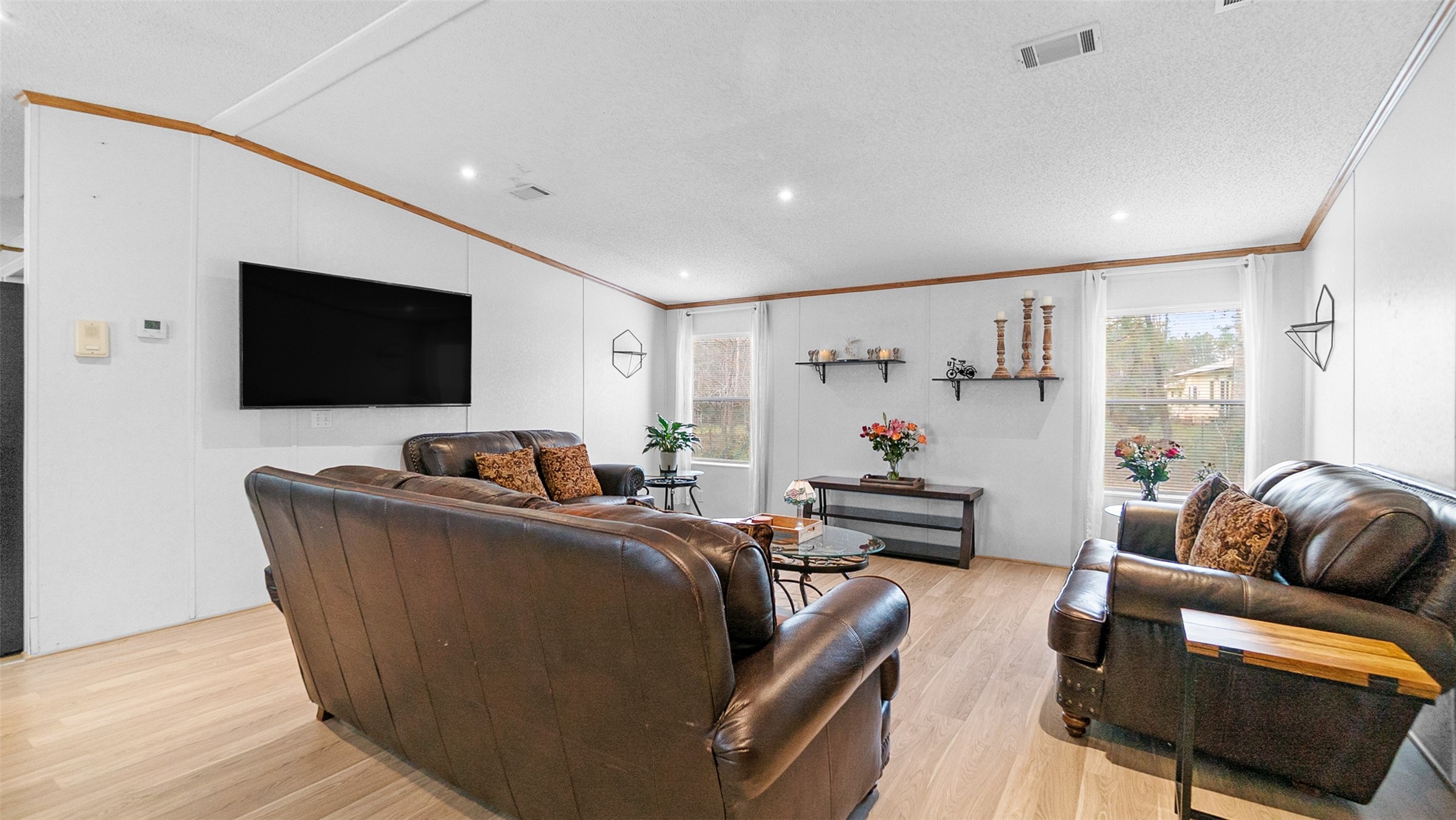 7735 North Walker Road Cleveland, TX 77328 - Photo 22 of 42 a living room with furniture and a flat screen tv