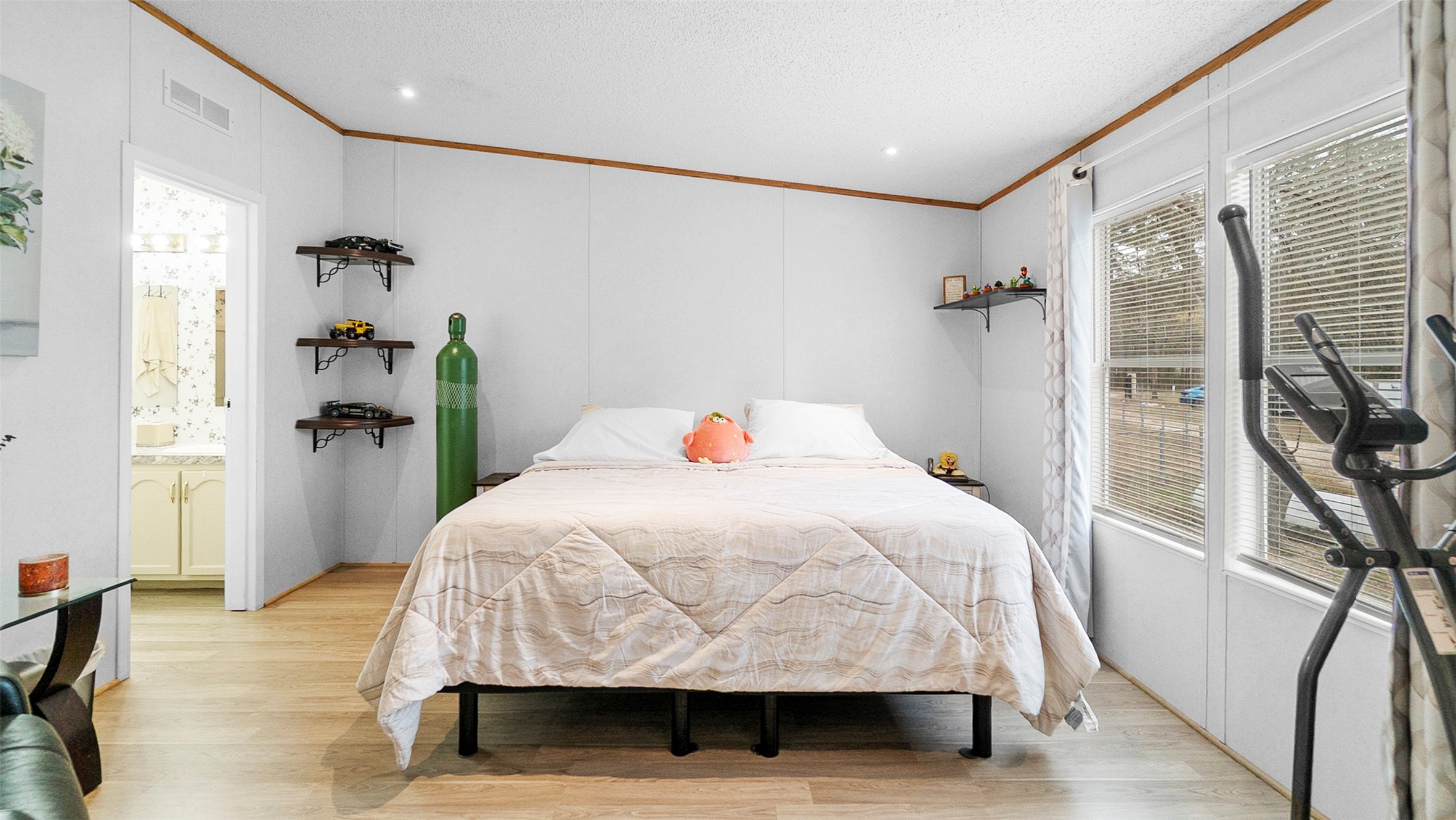 7735 North Walker Road Cleveland, TX 77328 - Photo 25 of 42 a bedroom with a bed and wooden floor