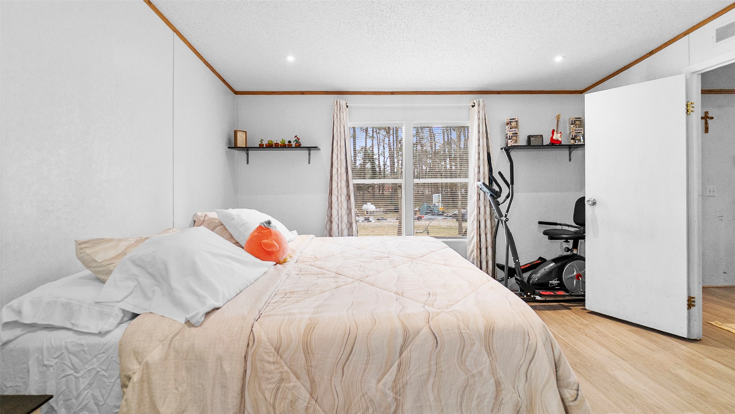 7735 North Walker Road Cleveland, TX 77328 - Photo 26 of 42 a bedroom with a bed and a large window