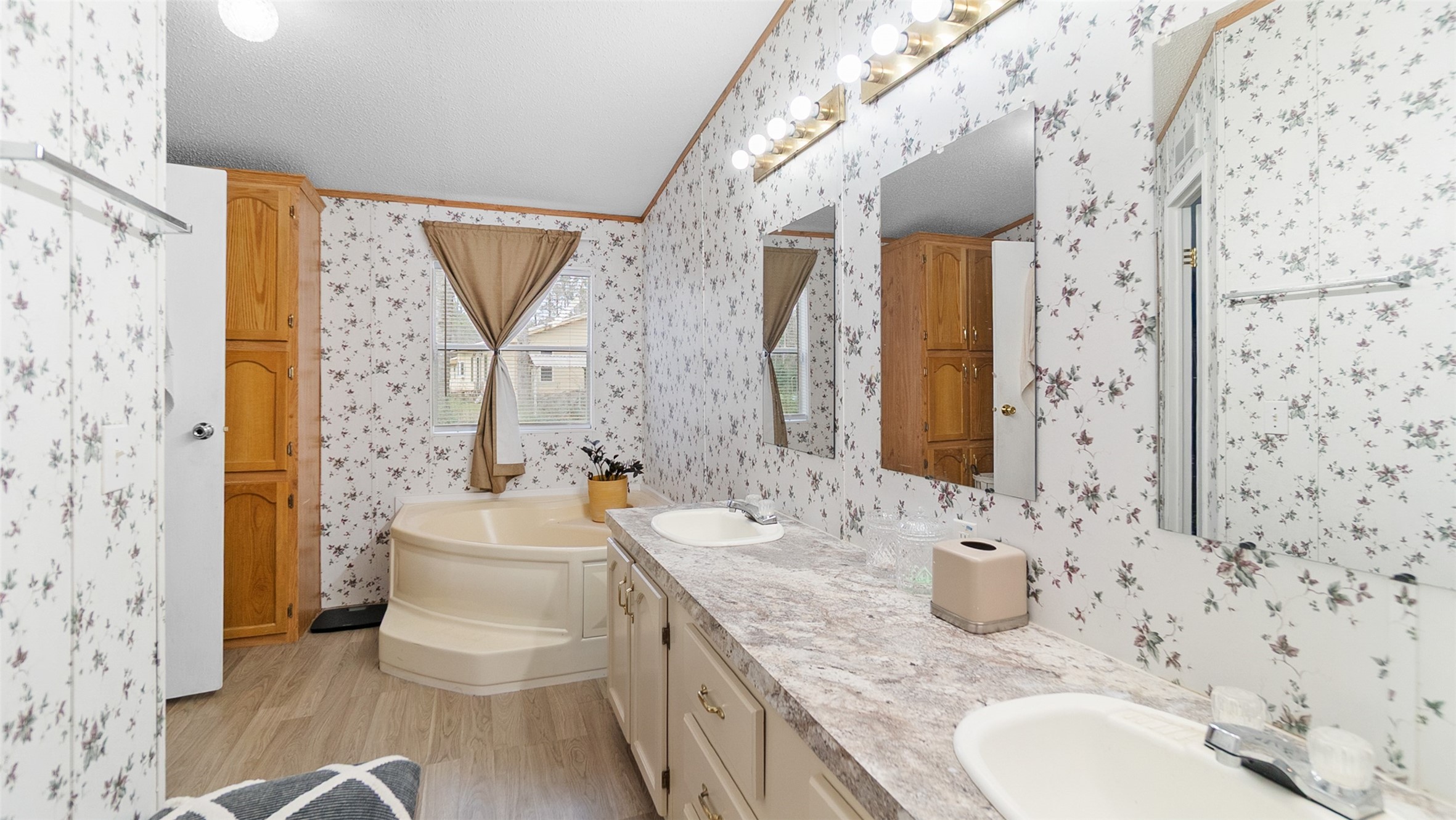 7735 North Walker Road Cleveland, TX 77328 - Photo 27 of 42 a bathroom with a granite countertop sink and a mirror