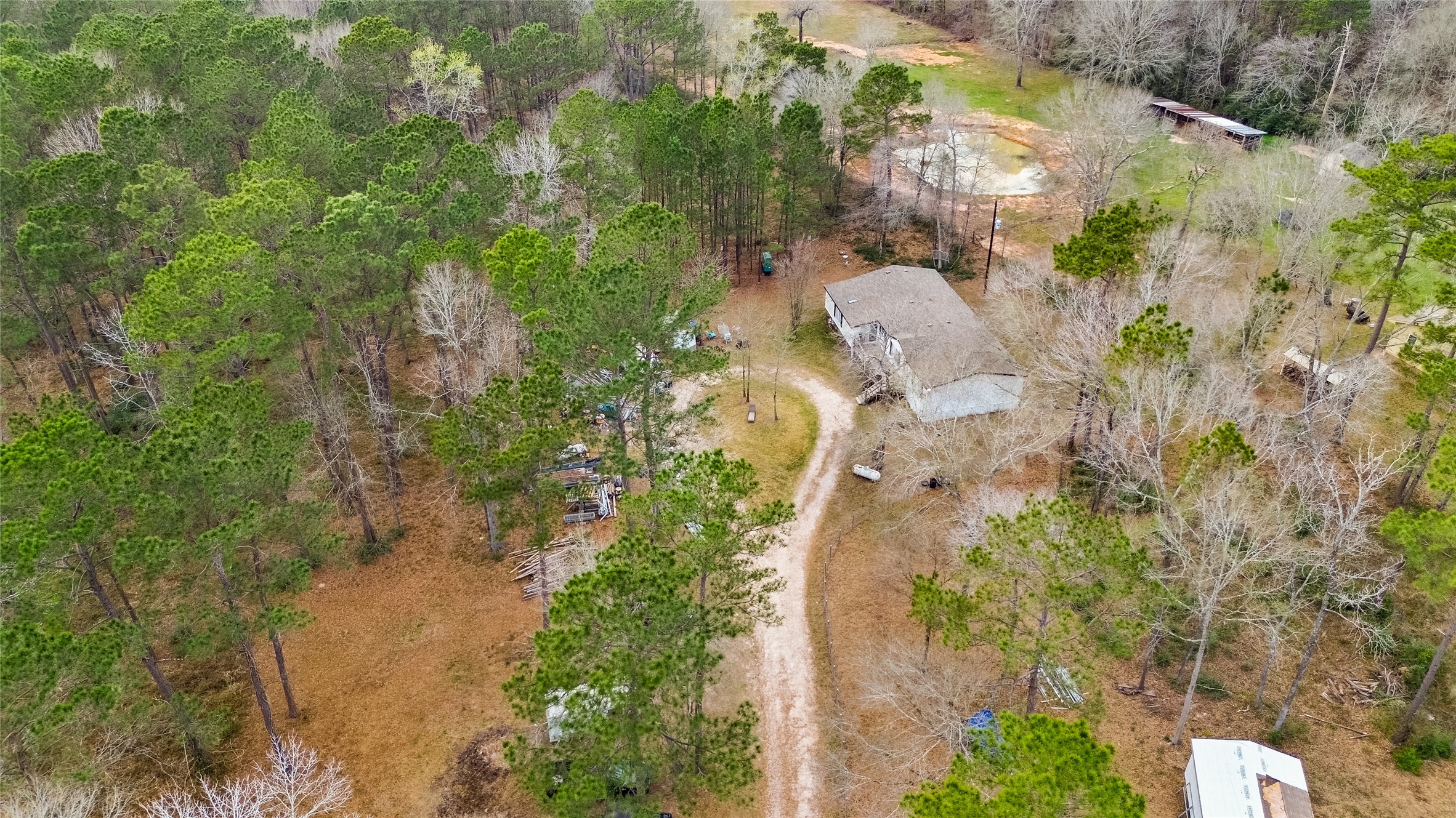 7735 North Walker Road Cleveland, TX 77328 - Photo 3 of 42 an aerial view of a house with a yard