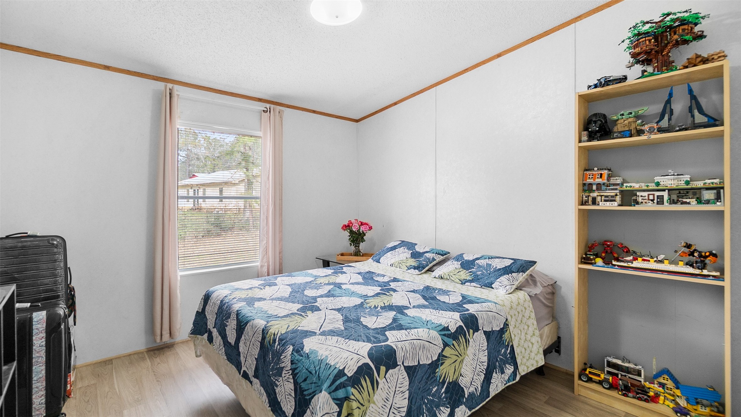 7735 North Walker Road Cleveland, TX 77328 - Photo 31 of 42 a bedroom with a bed and a window