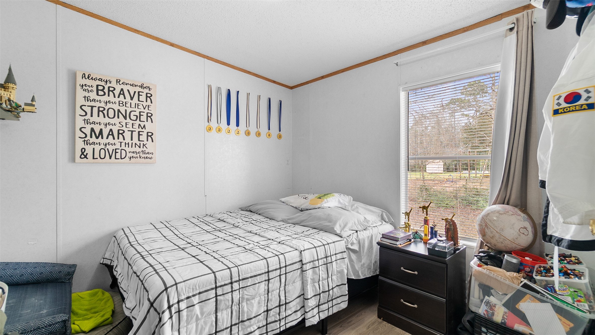 7735 North Walker Road Cleveland, TX 77328 - Photo 33 of 42 a bedroom with a bed and a window