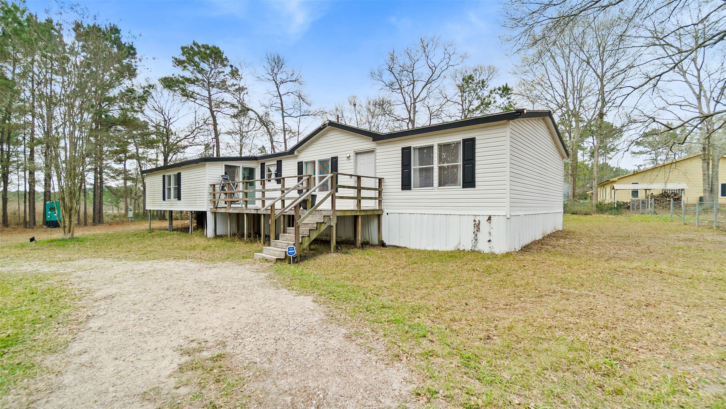 7735 North Walker Road Cleveland, TX 77328 - Photo 36 of 42 a view of a house with a yard