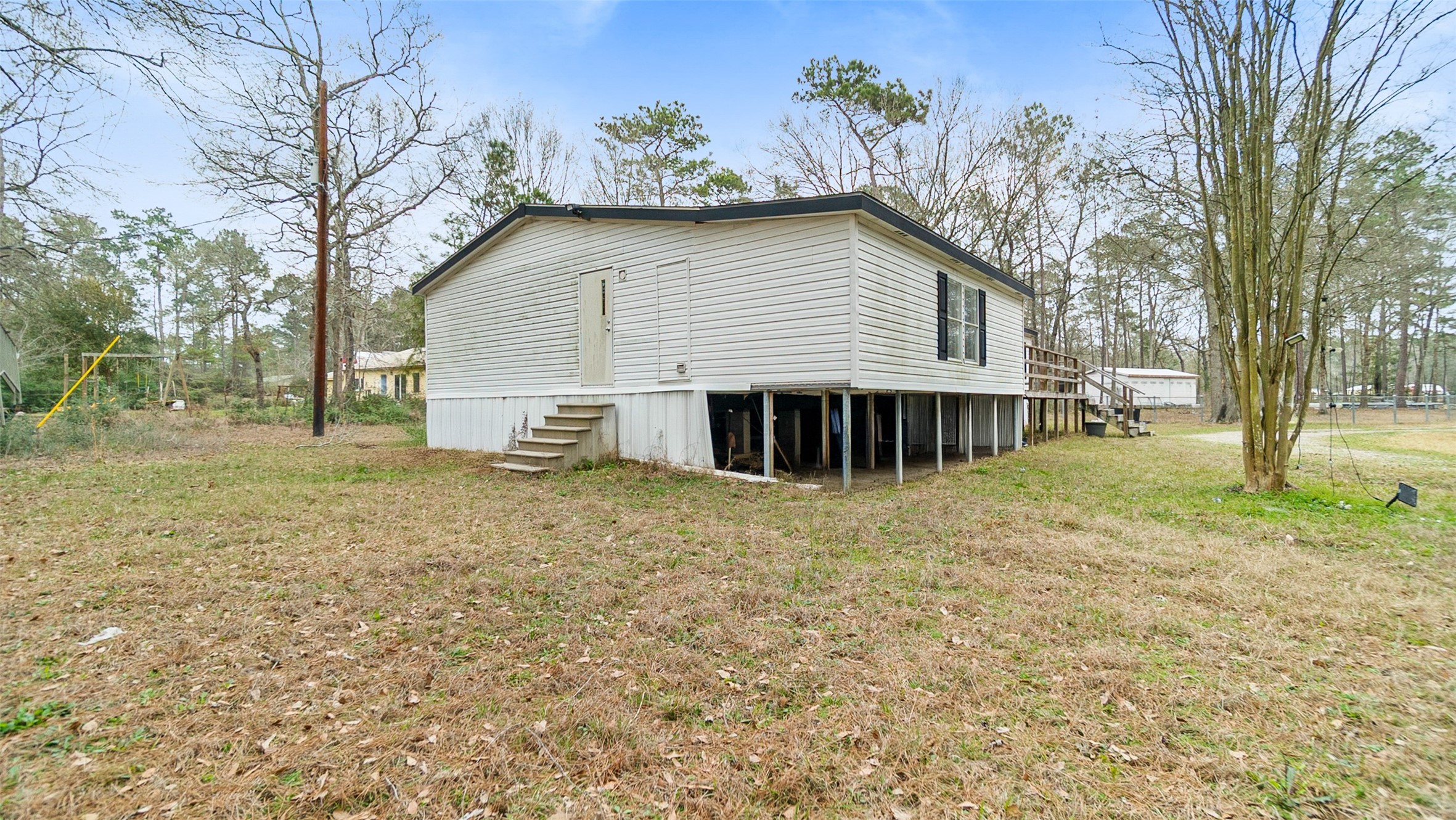 7735 North Walker Road Cleveland, TX 77328 - Photo 37 of 42 a view of a house with a yard and tree