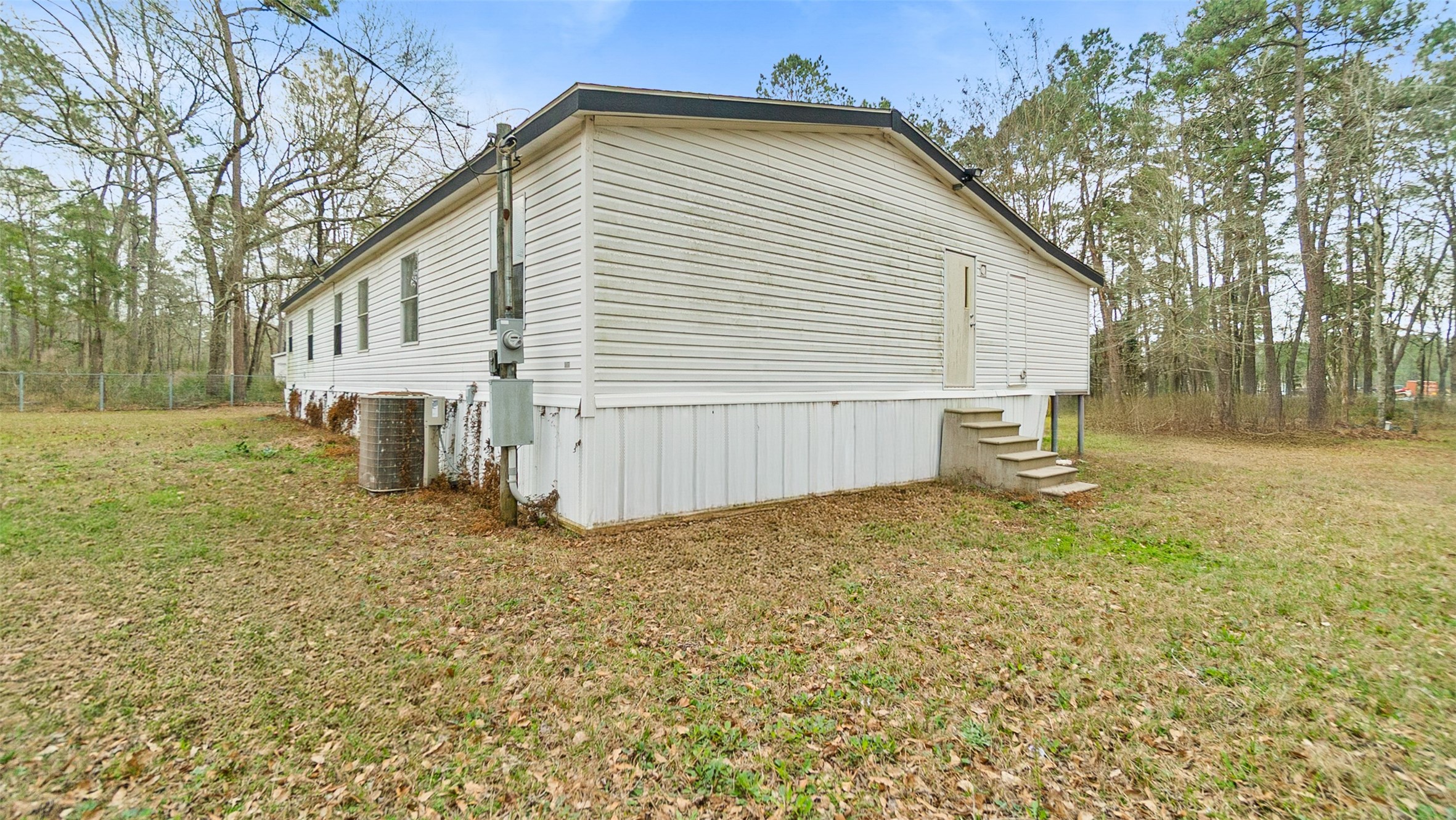 7735 North Walker Road Cleveland, TX 77328 - Photo 38 of 42 a view of a backyard of the house