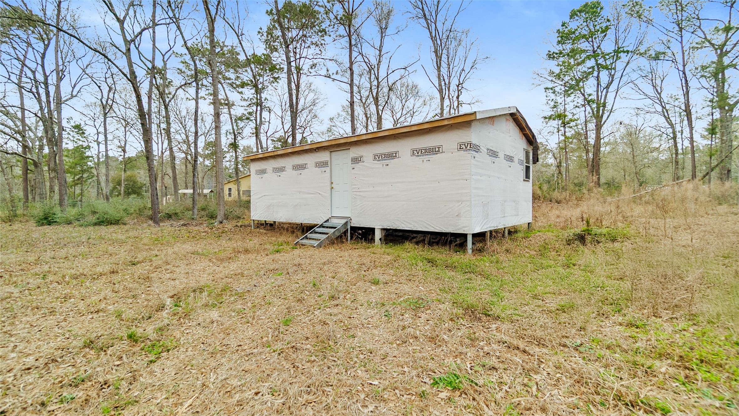 7735 North Walker Road Cleveland, TX 77328 - Photo 39 of 42 a view of backyard with large trees