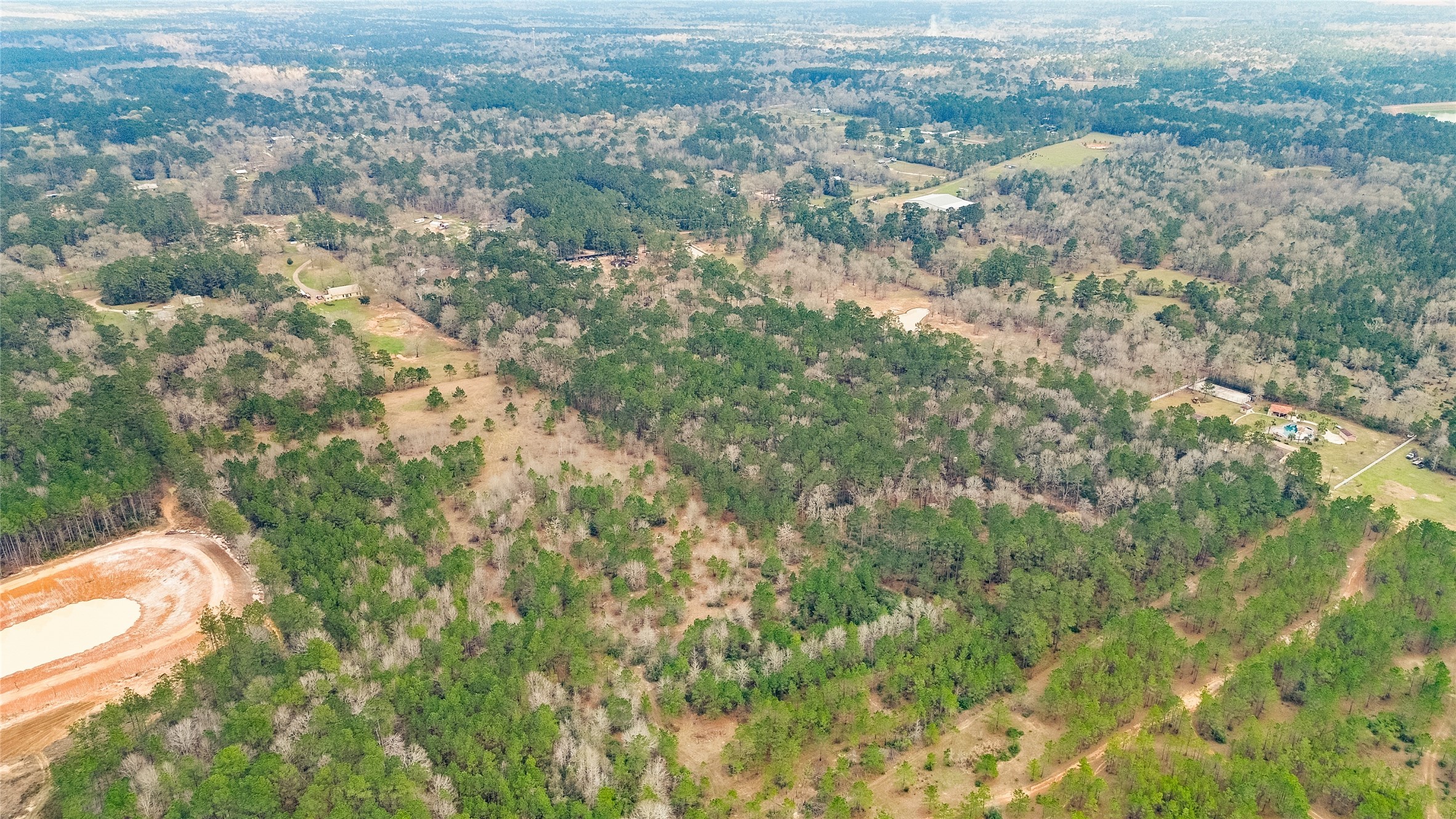 7735 North Walker Road Cleveland, TX 77328 - Photo 41 of 42 an aerial view of residential houses with outdoor space and trees