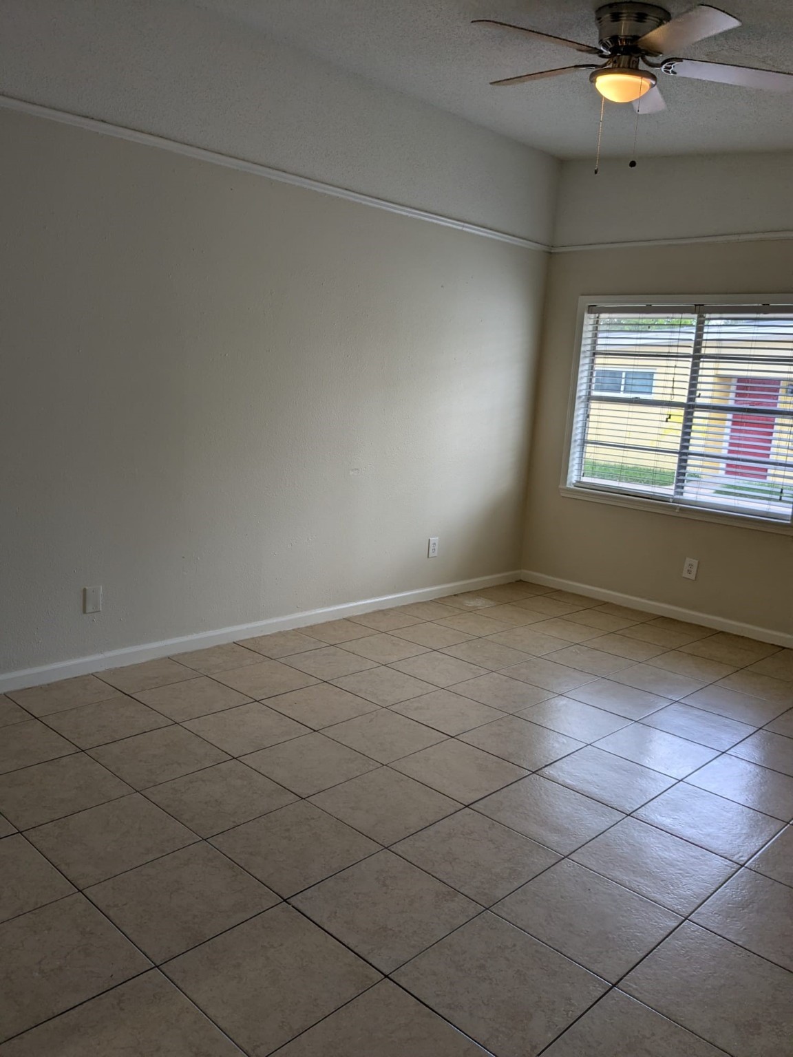 3359 Frick Road, Unit 6 Houston, TX 77086 - Photo 2 of 10 an empty room with a window