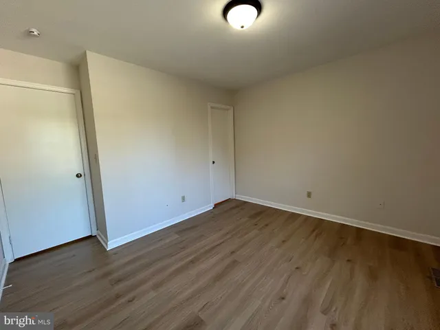 a bathroom with a sink a toilet a shower and a mirror