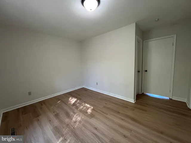 a bathroom with a sink mirror vanity and toilet