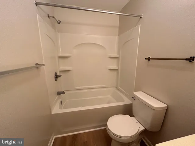 a bathroom with a toilet and a sink