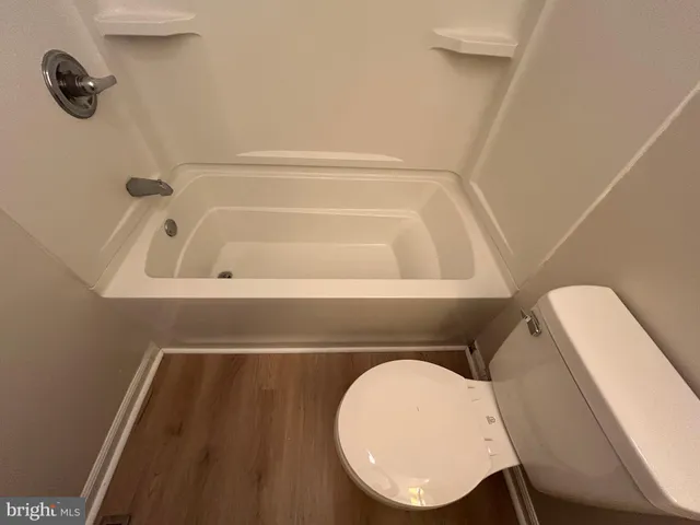 a bathroom with a sink toilet and vanity