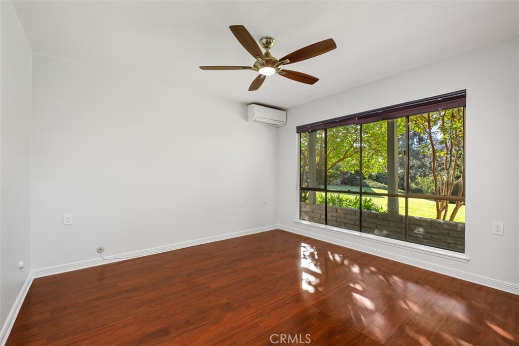 842 Ronda Sevilla, Unit B Laguna Woods, CA 92637 - Photo 8 of 27 a view of an empty room with a window
