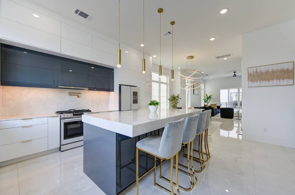 5702 Fairdale Lane, Unit C Houston, TX 77057 - Photo 11 of 47 a kitchen with a table and chairs in it