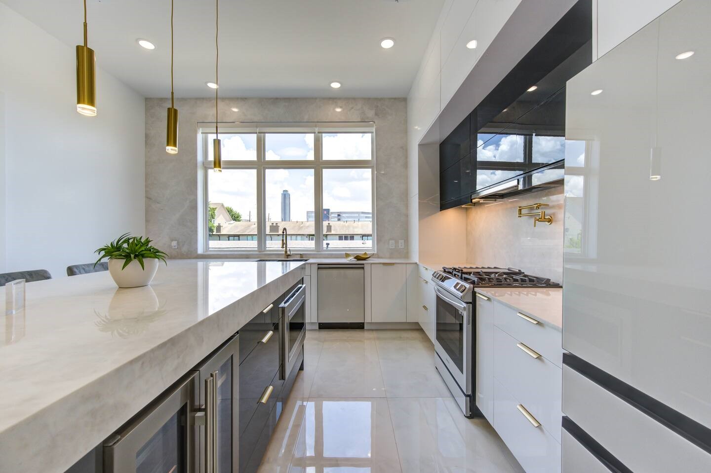 5702 Fairdale Lane, Unit C Houston, TX 77057 - Photo 12 of 47 a kitchen with granite countertop a stove a sink and a refrigerator