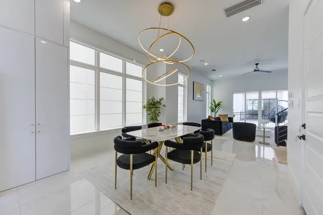 a view of a livingroom with furniture window and wooden floor