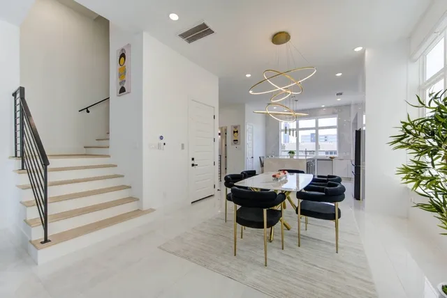 a living room with fireplace furniture and a flat screen tv