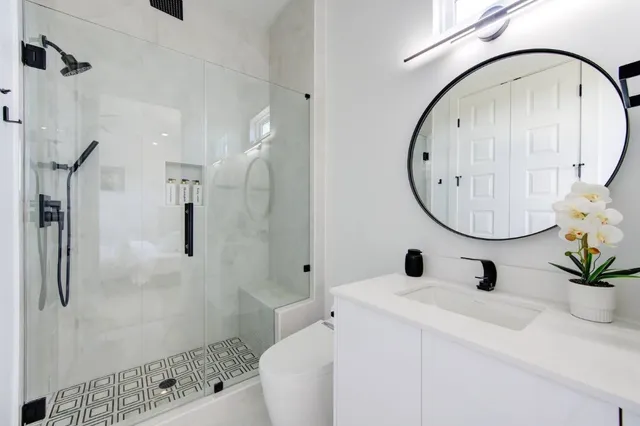 a view of a hallway with wooden floor and closet