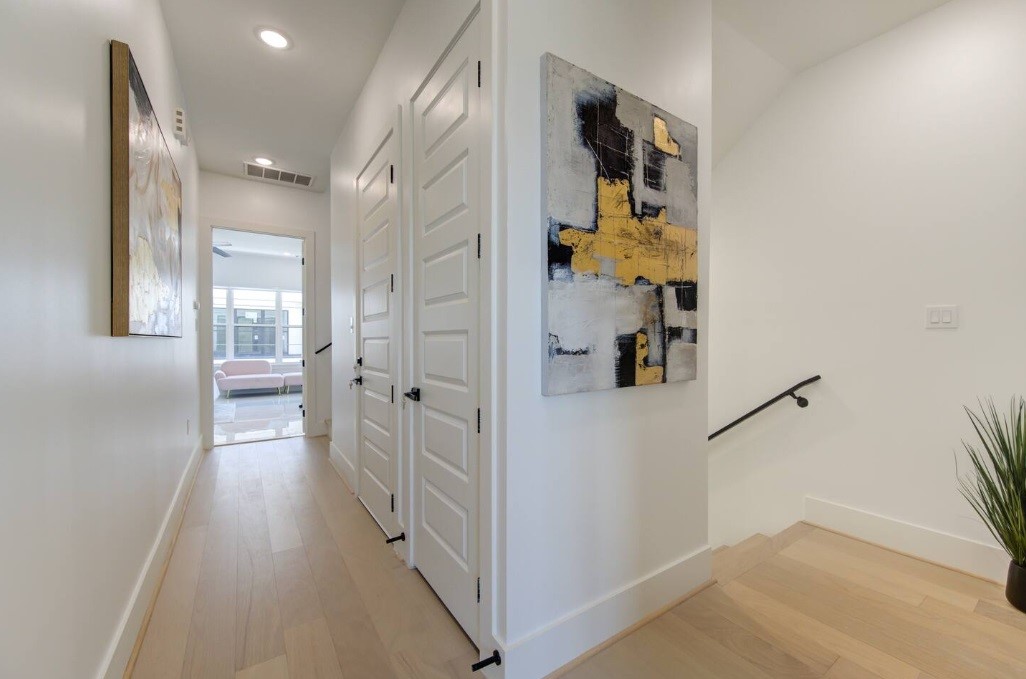 5702 Fairdale Lane, Unit C Houston, TX 77057 - Photo 36 of 47 a view of a hallway with wooden floor and closet