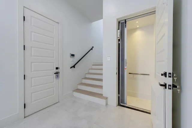 a view of a hallway with closet and entryway