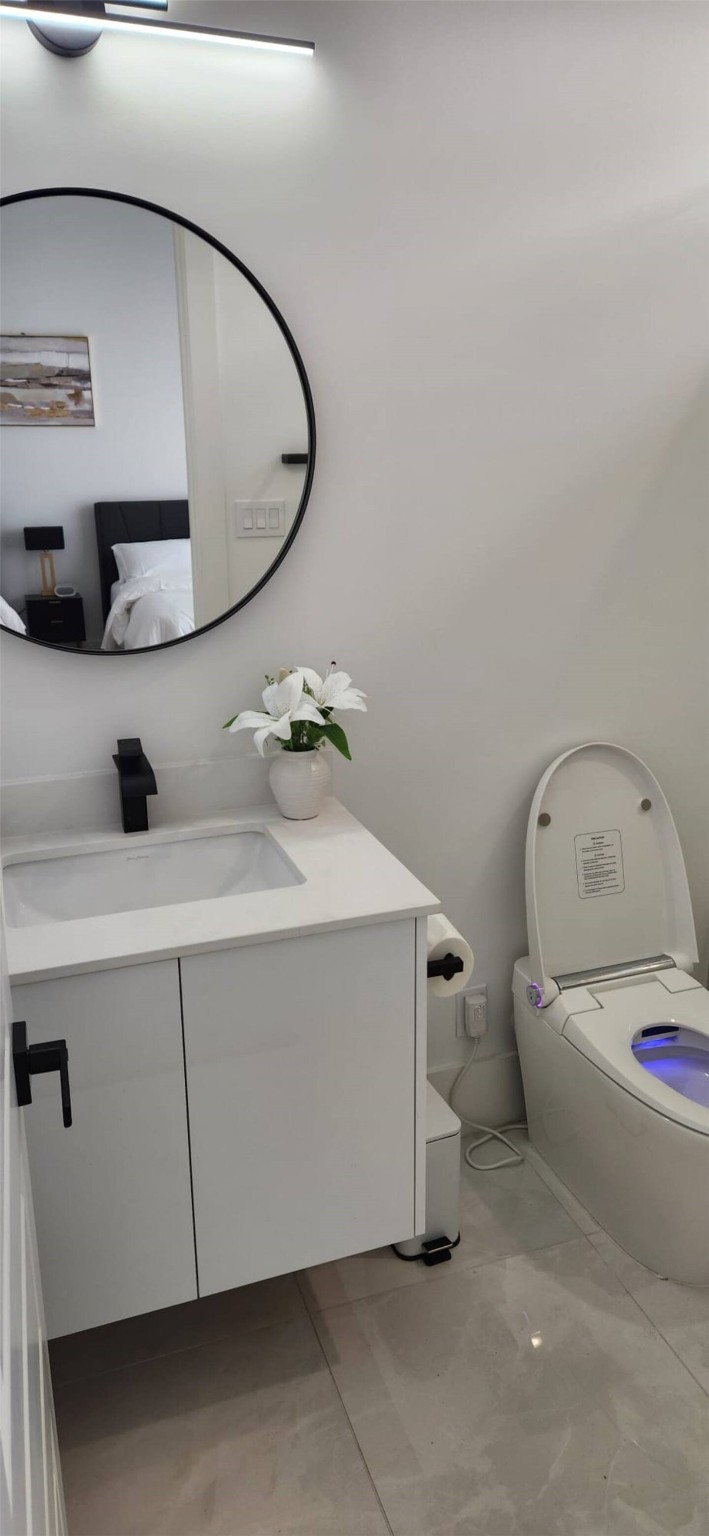 5702 Fairdale Lane, Unit C Houston, TX 77057 - Photo 9 of 47 a bathroom with a sink and mirror