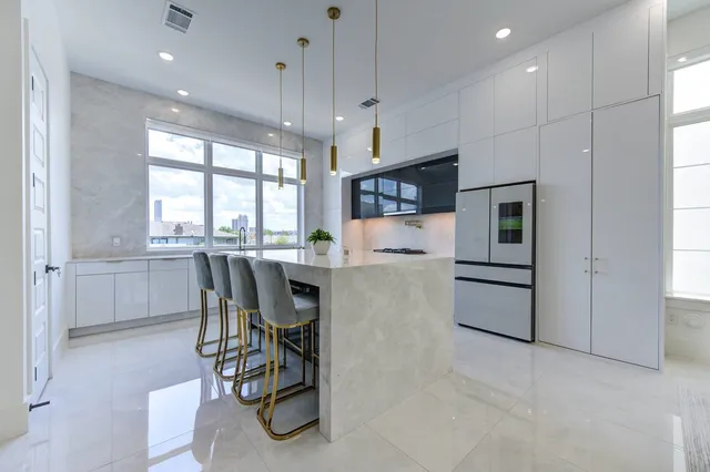 a kitchen with a table and chairs in it