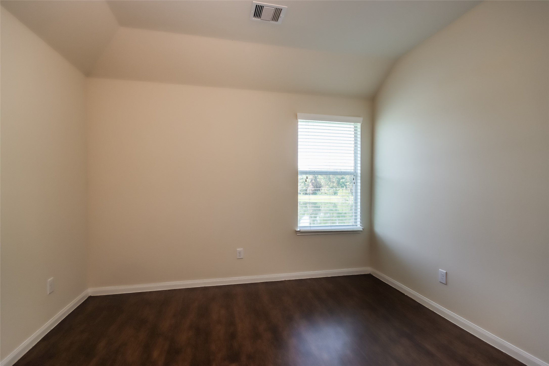 13022 Ristina Circle Houston, TX 77048 - Photo 14 of 15 an empty room with wooden floor and windows