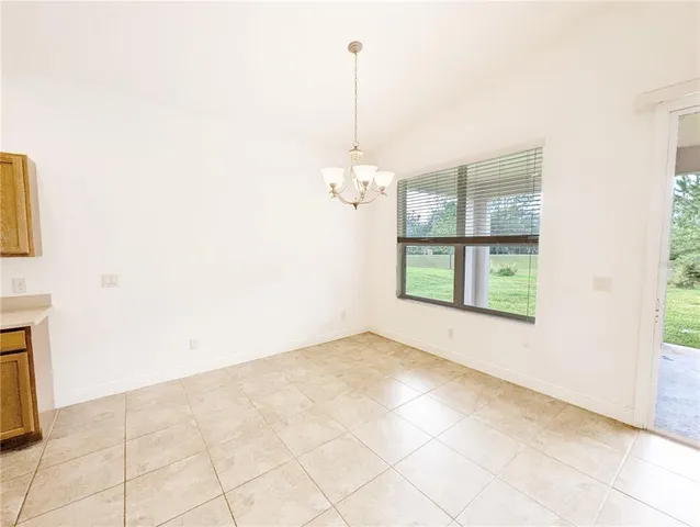 a view of an empty room with windows