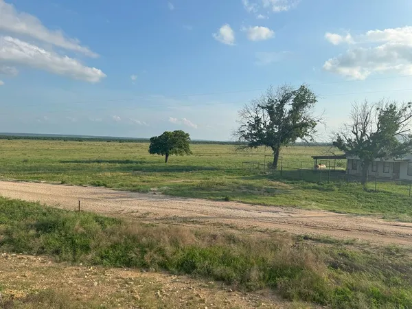 a view of a golf course with a lake