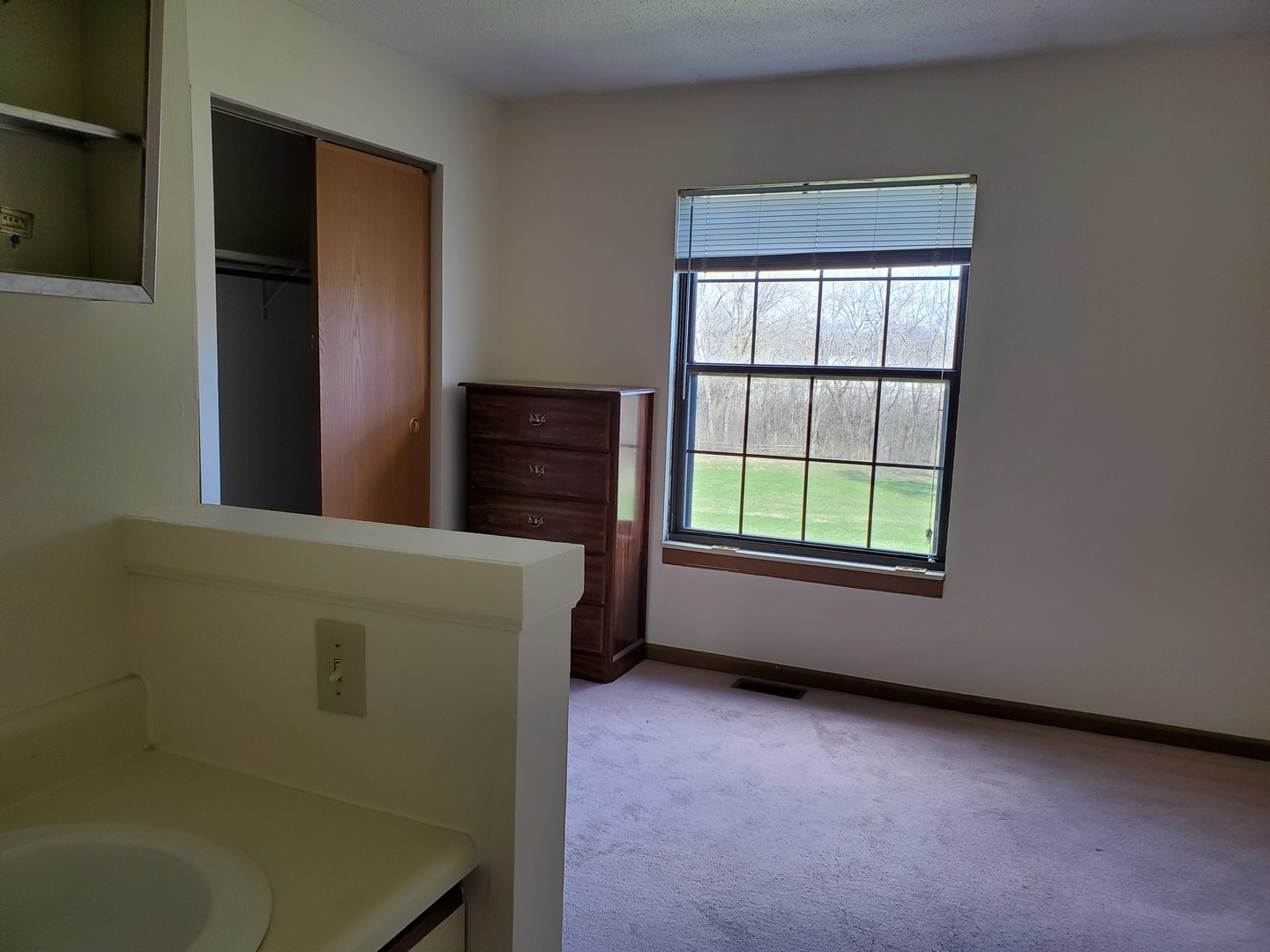 700 North Adelaide Street, Unit 49 Normal, IL 61761 - Photo 8 of 15 a view of an empty room with a window