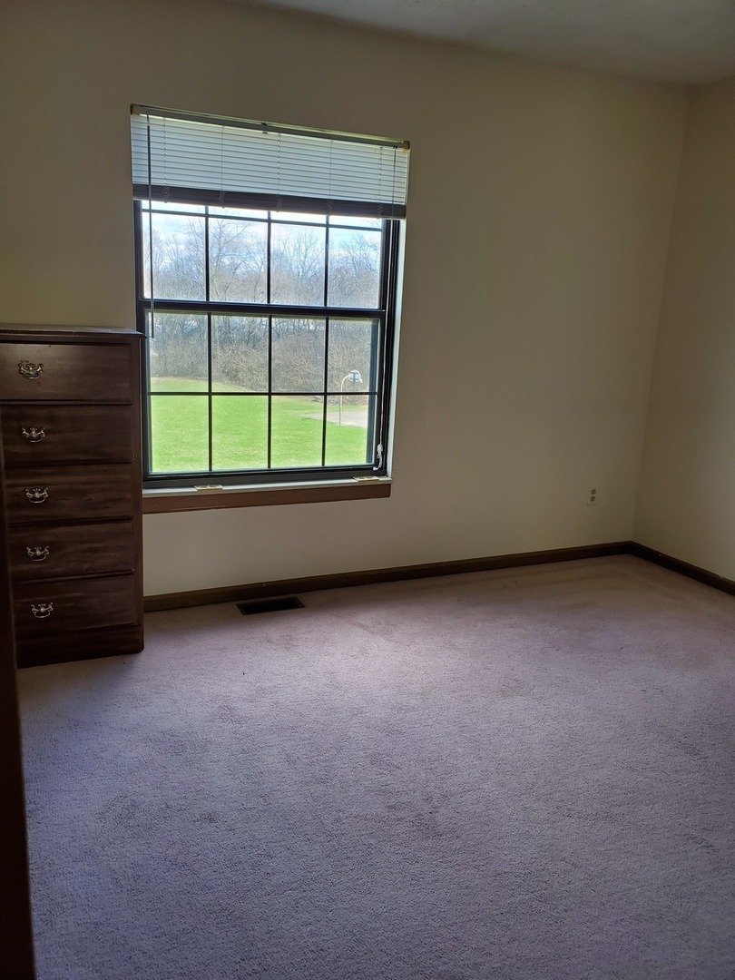 700 North Adelaide Street, Unit 49 Normal, IL 61761 - Photo 10 of 15 an empty room with a window