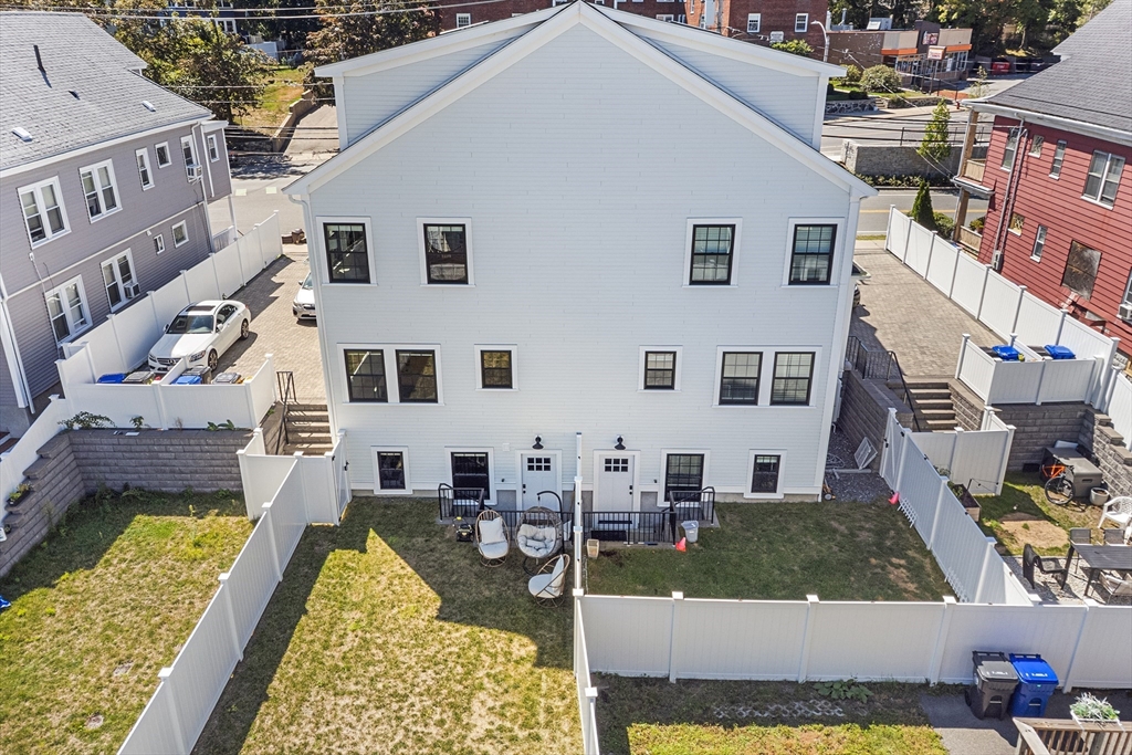11 Lowell Street, Unit B Arlington, MA 02476 - Photo 26 of 31 a aerial view of a house with swimming pool