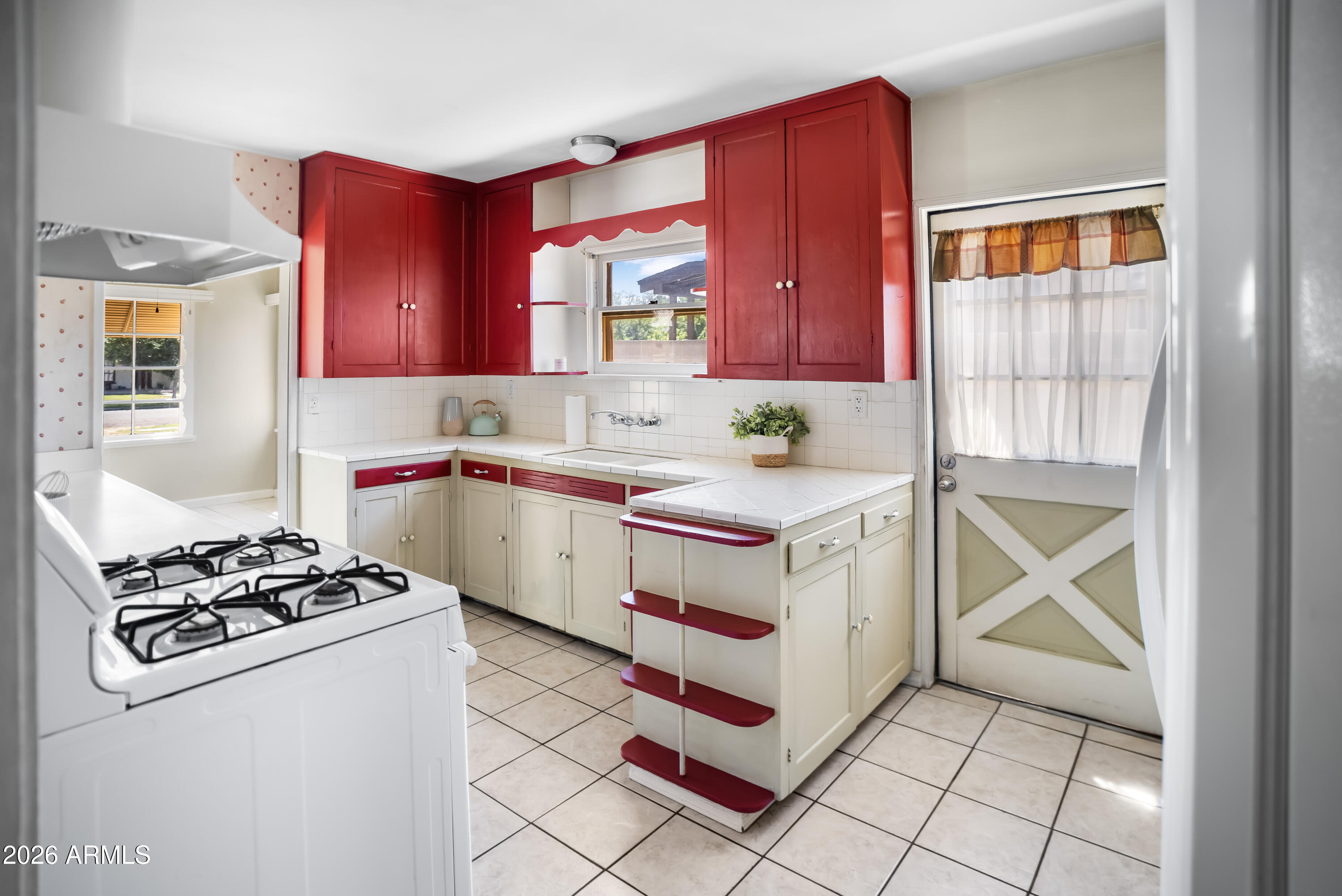 508 North Robson Mesa, AZ 85201 - Photo 9 of 19 a kitchen with a stove a sink and a microwave