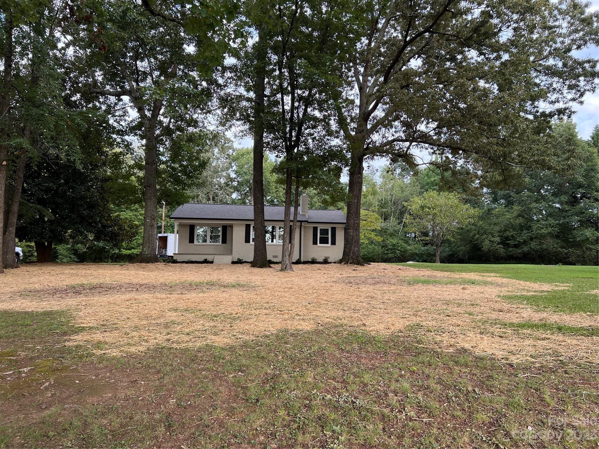 4982 Tabernacle Road Lancaster, SC 29720 - Photo 1 of 22 a front view of a house with a garden and trees