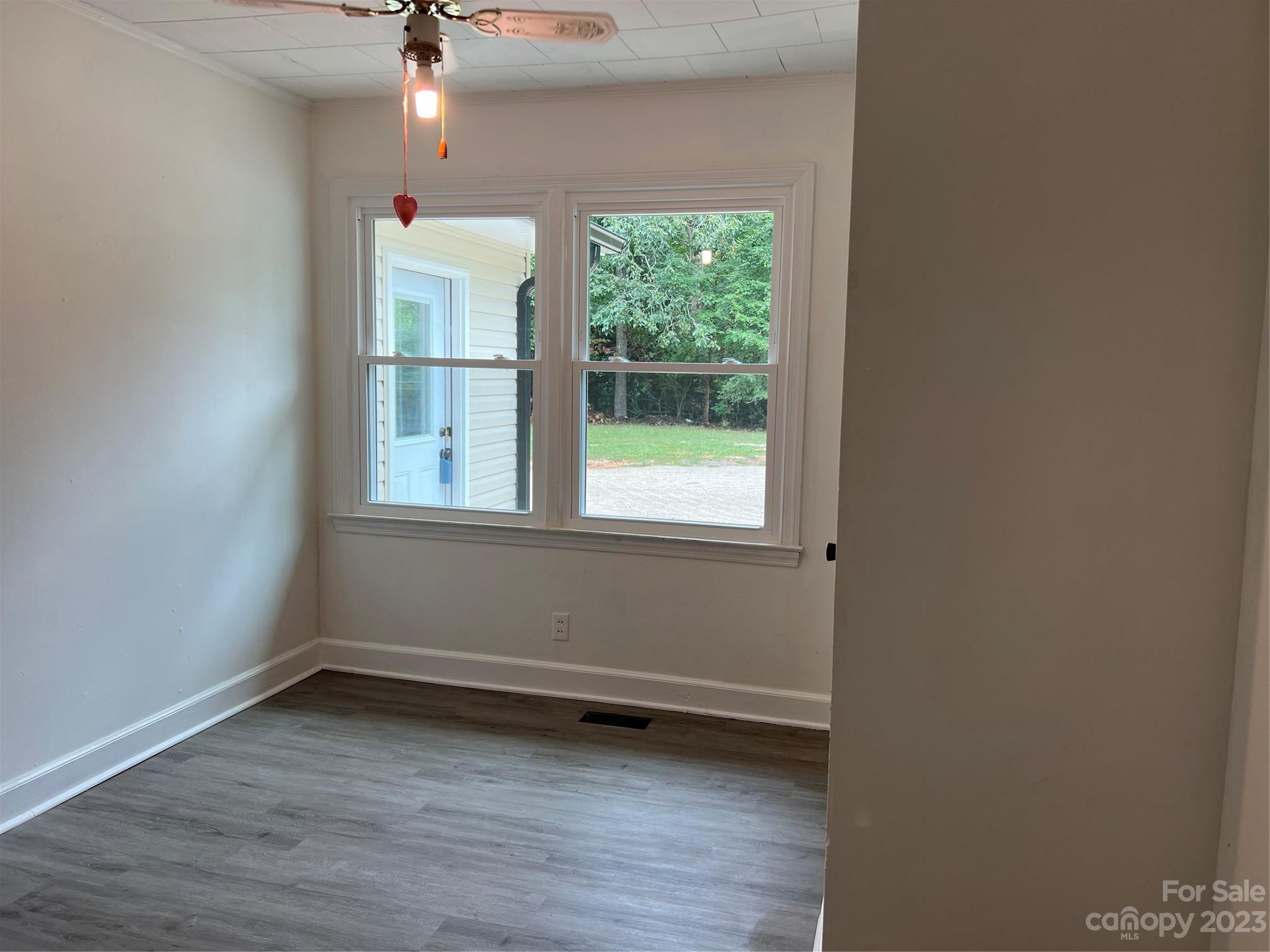 4982 Tabernacle Road Lancaster, SC 29720 - Photo 13 of 22 a view of a room with wooden floor and windows