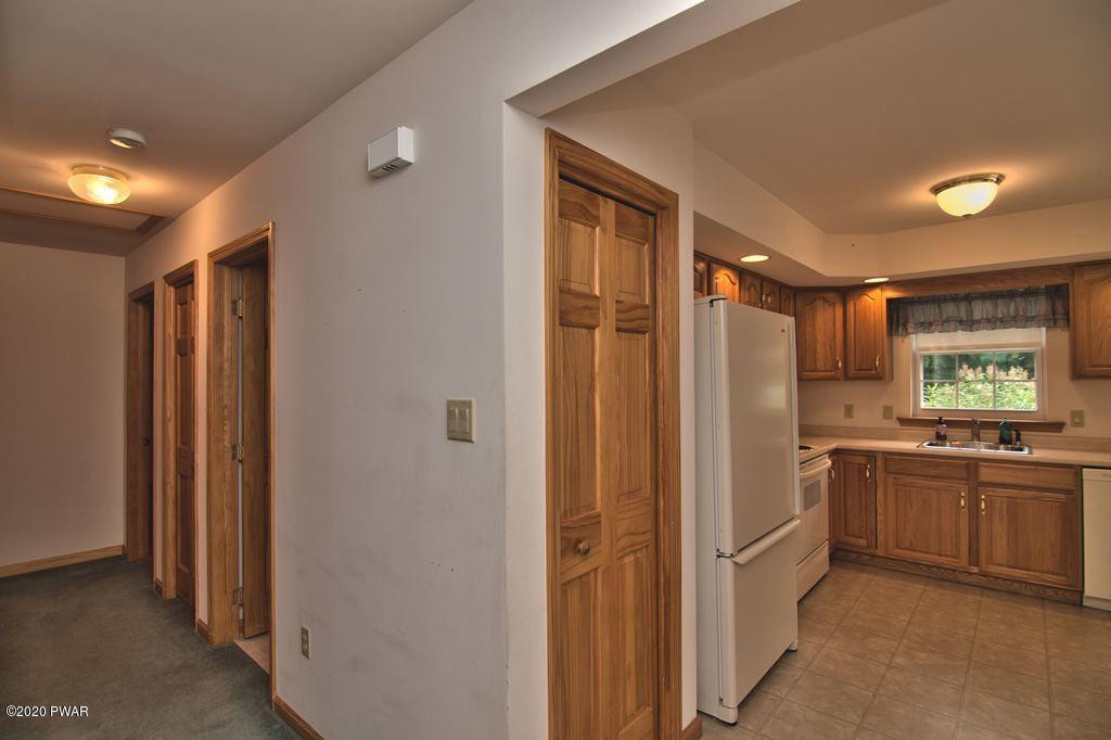 63 Callapoose Road Moscow, PA 18444 - Photo 23 of 73 a kitchen with stainless steel appliances granite countertop a refrigerator and a sink