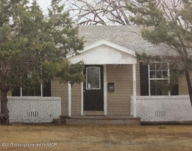 4111 South Bonham Street Amarillo, TX 79110 - Photo 1 of 1 a front view of a house with a tree