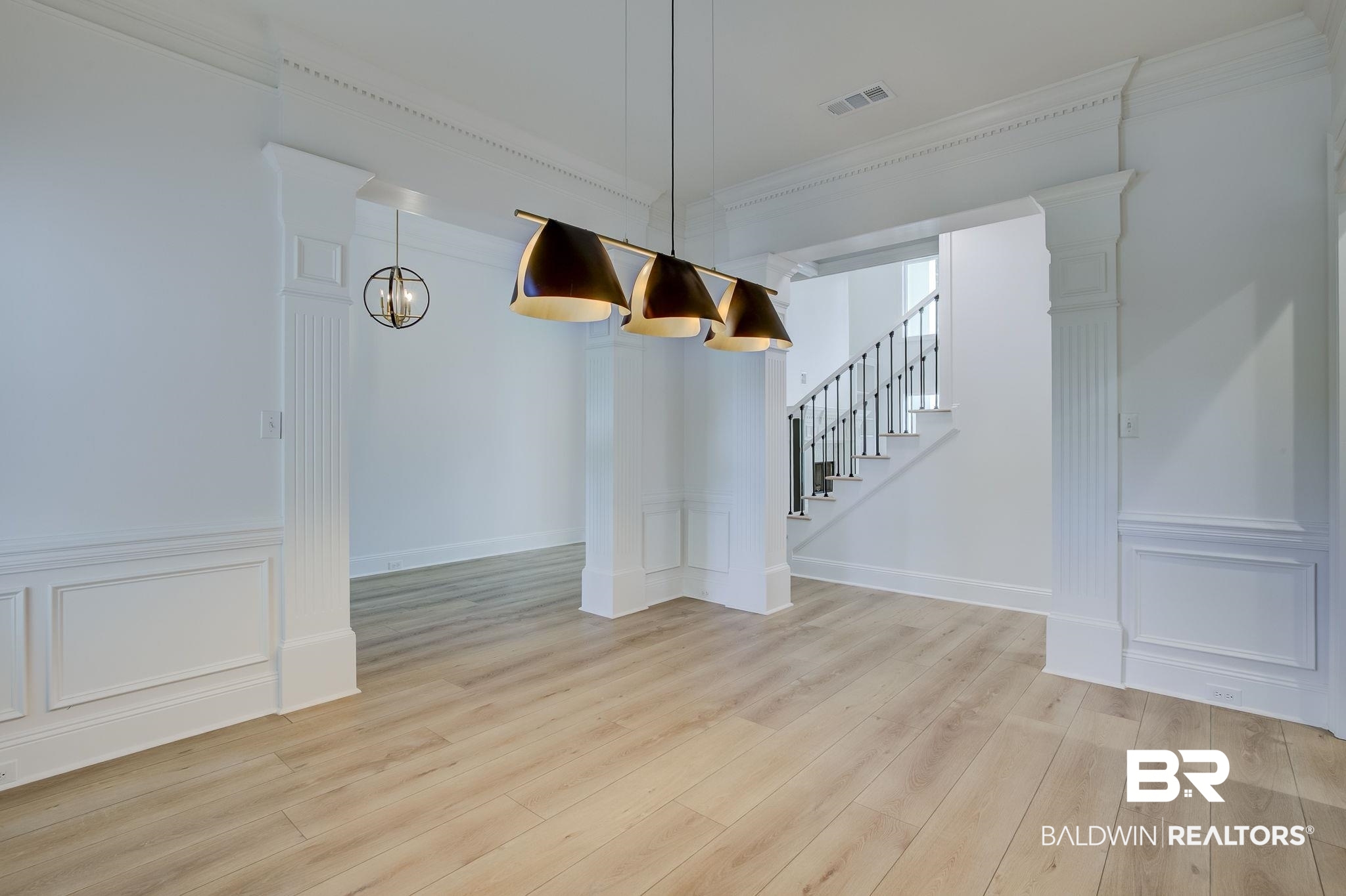 105 High Pines Ridge Fairhope, AL 36532 - Photo 36 of 97 Unfurnished dining area with light wood-style floors, stairway, ornamental molding, and a chandelier