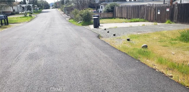 a view of a backyard with swimming pool