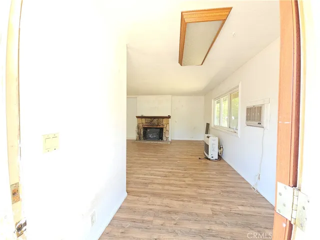 a bedroom with a bed and a mirror