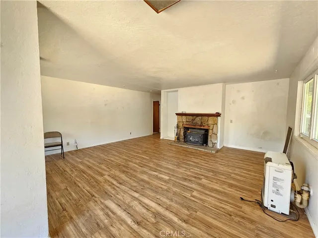 a bedroom with a bed and a fireplace