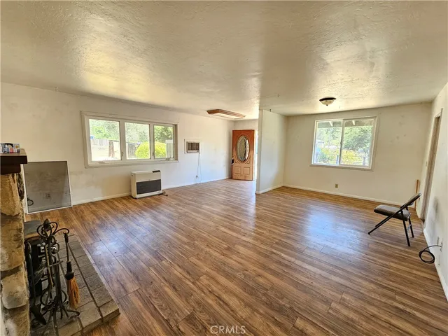a view of livingroom with hardwood floor and a window