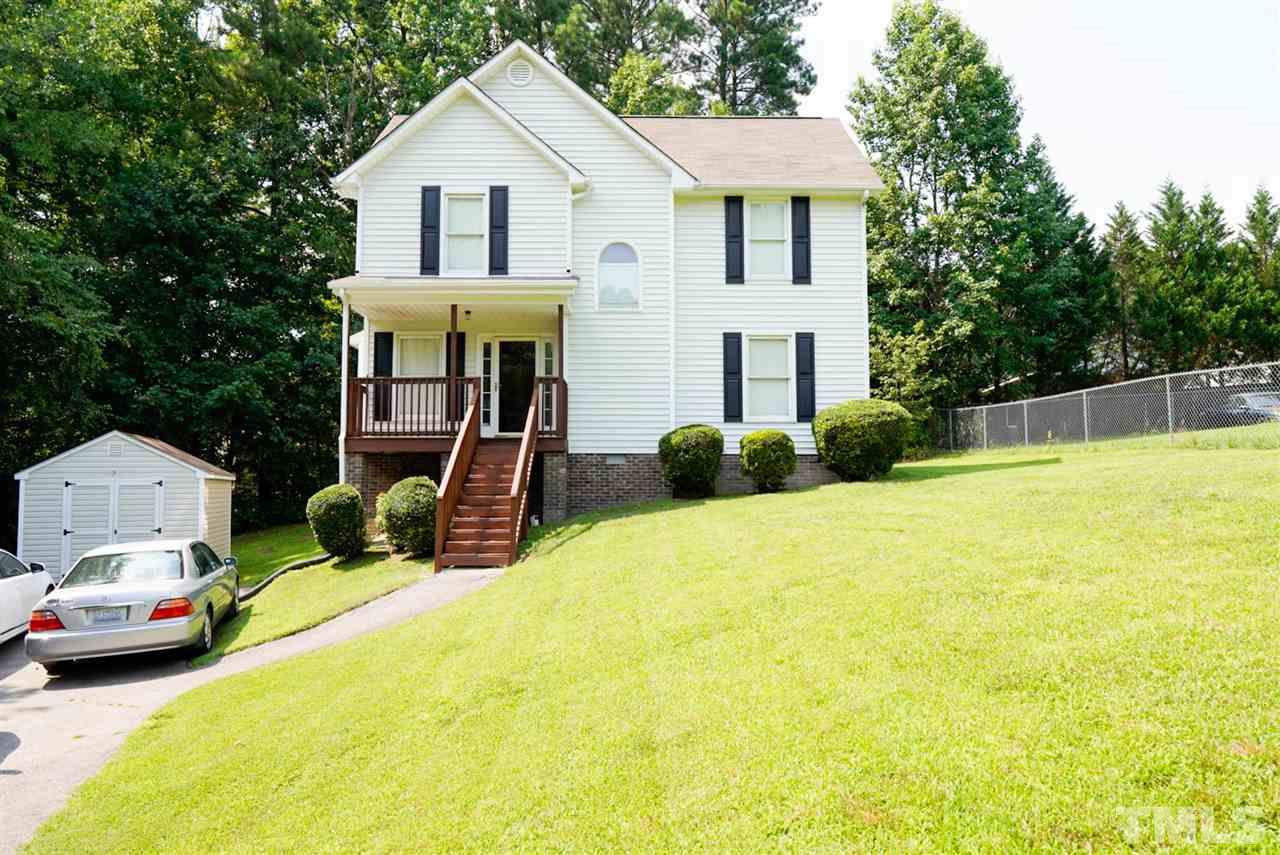 438 Gus Road Durham, NC 27703 - Photo 1 of 3 a view of a white house with chairs and a small yard