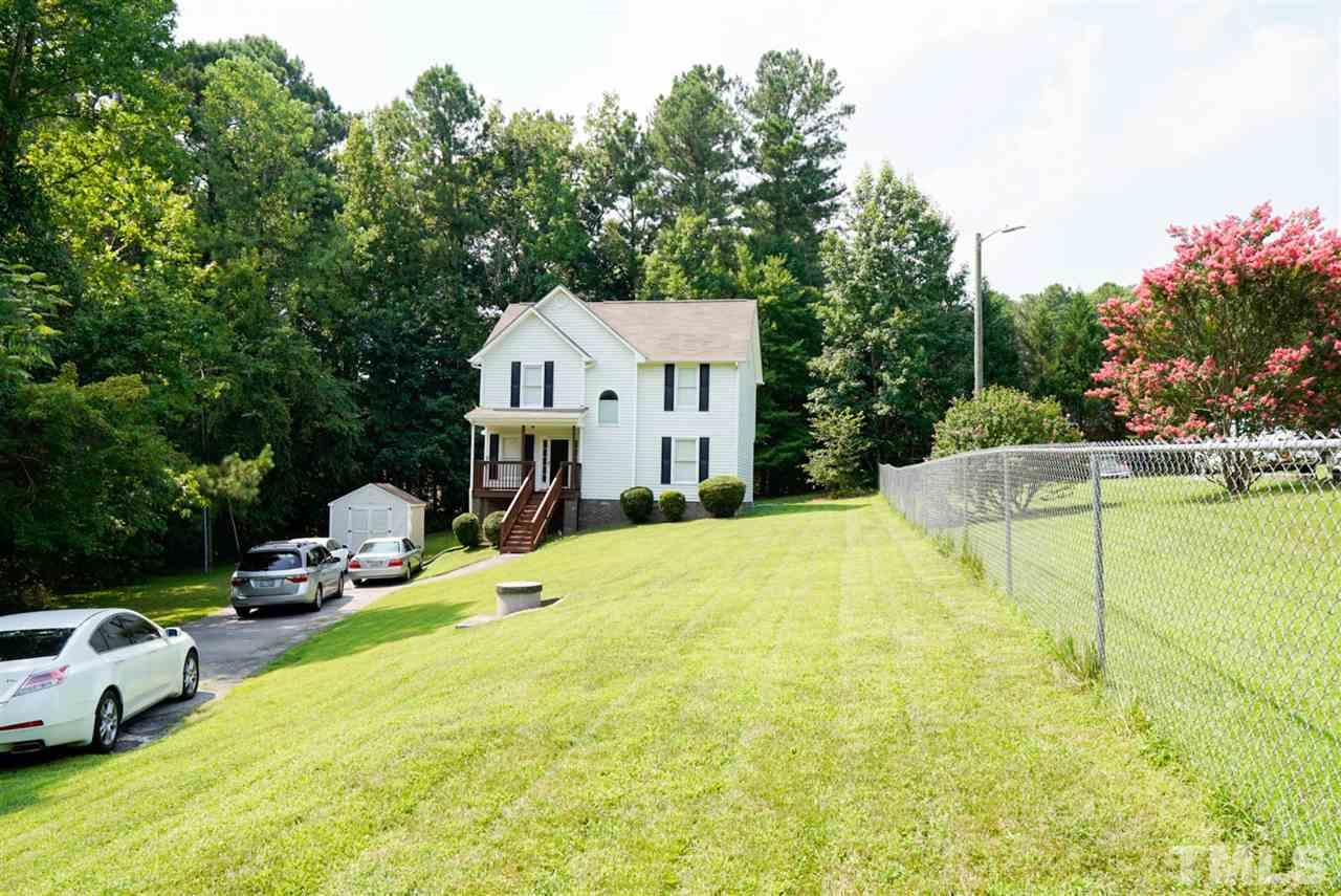 438 Gus Road Durham, NC 27703 - Photo 2 of 3 a front view of a house with swimming pool and porch